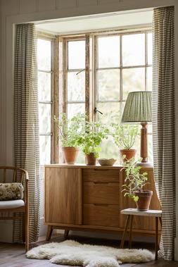 DFS Filip Spindle Chair in Oa, DFS Filip Sideboard in Oak.