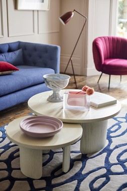 DFS Mya Three-Seater Sofa in Simply Wool Look in Indigo Blue, Dwell Kelda Accent Chair in Red Wine Velvet, available at DFS, Dwell Becc Nesting Coffee Tables, available at DFS