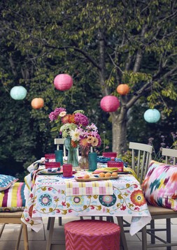 Nylon rope planters, from £12, Cushions, from £15, Beldi floral tablecloth £35, Beldi floral bench pad £45, Paper lanterns, set of 3 £25, Nylon rope lanterns, from £12 & Giant daisy stake £22