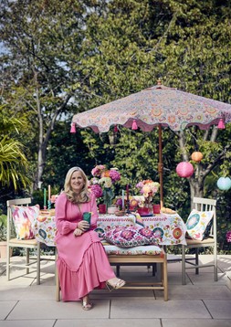 Nylon rope planters, from £12, Cushions, from £15, Beldi floral tablecloth £35, Beldi floral bench pad £45, Beldi floral parasol £89, Paper lanterns, set of 3 £25, Nylon rope lanterns, from £12 & Giant daisy stake £22