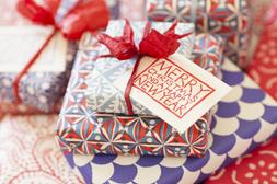 Pile of presents in Cambridge Imprint paper