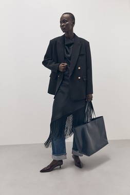 Tu-AW26-Model-24 - Black Military Jacket £40 Black Satin Fringe Midi Dress £30 High-Shine Navy Tote Bag £22 Heeled Point Court Shoe £22