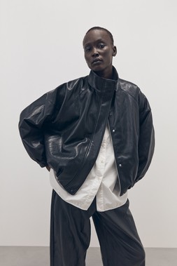 Tu-AW26-Model-26 - Black PU Batwing Funnel-Neck Bomber Jacket £40, White Poplin Relaxed Shirt £20, Black PU Pull-On Barrel Trousers £24
