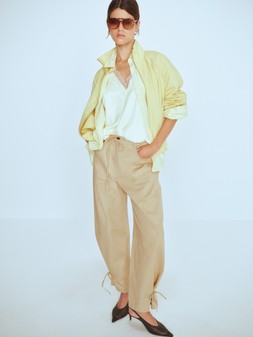 M&S Jacket £50, M&S Shirt £28, M&S Top £24, M&S Trousers £40, Sunglasses £16, Bag £26, Shoes £36