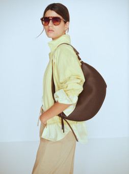 M&S Jacket £50, M&S Shirt £28, M&S Top £24, M&S Trousers £40, Sunglasses £16, Bag £26